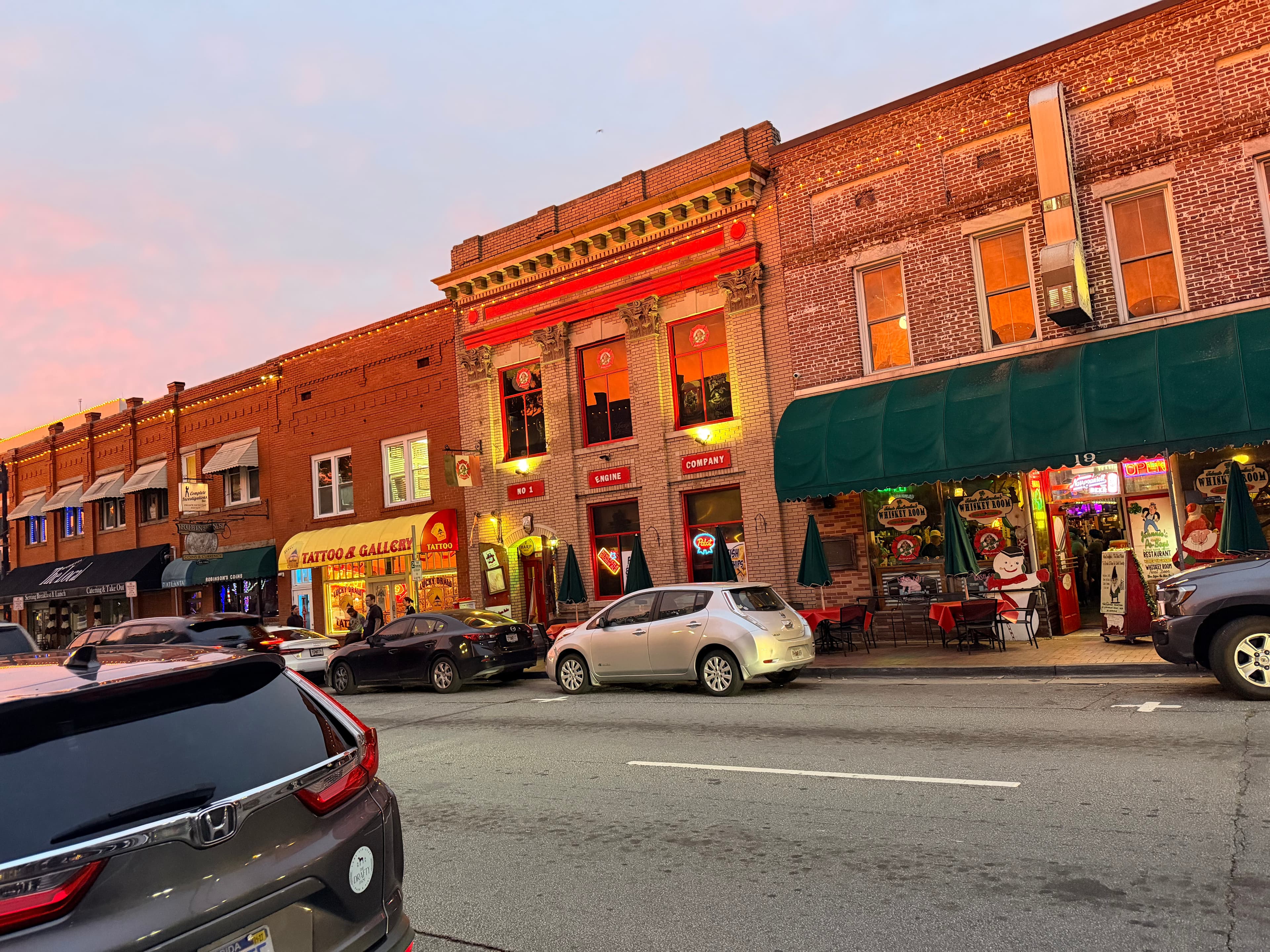 Historic brick storefronts and street at dusk